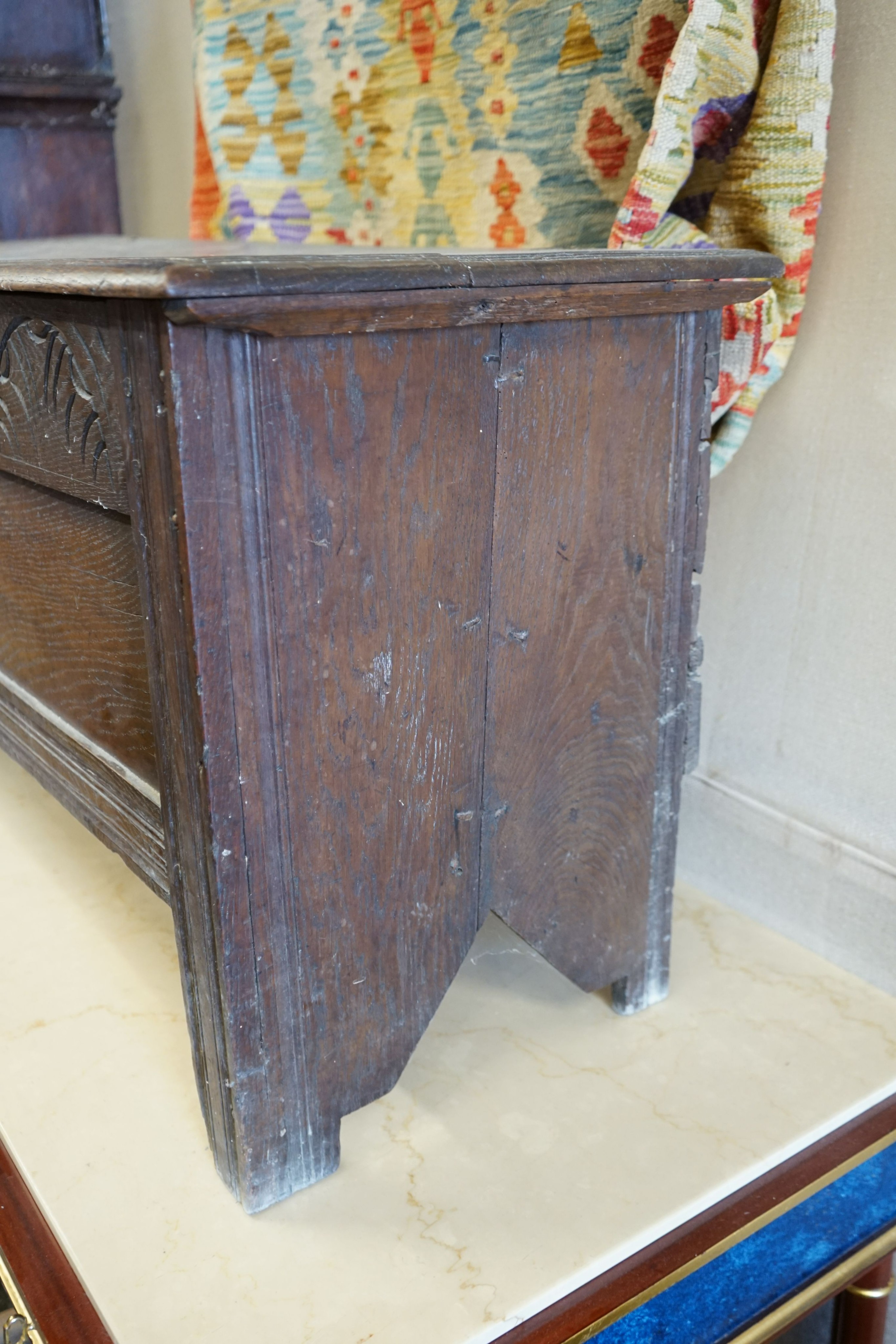 A 17th century and later carved oak six plank coffer, length 117cm, depth 43cm, height 56cm